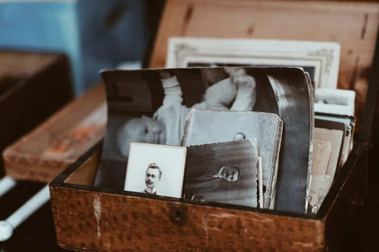 A collection of old family photographs in a box