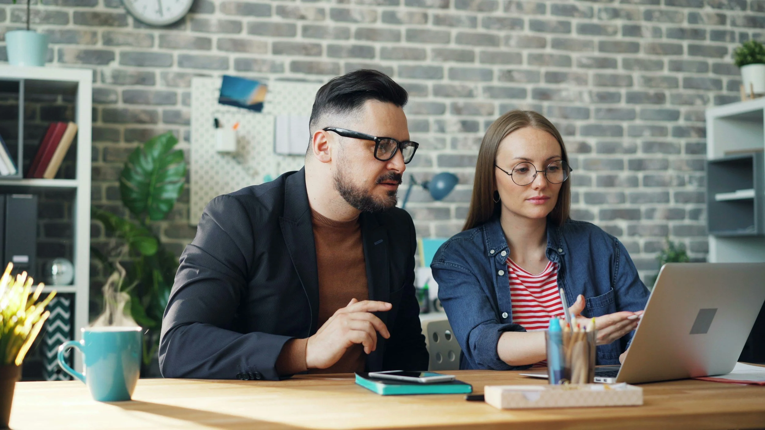 Two people planning at a table